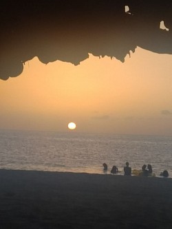 A small, yellow globe of light reveals the Sun's presence, as the sky gives off an orange hue